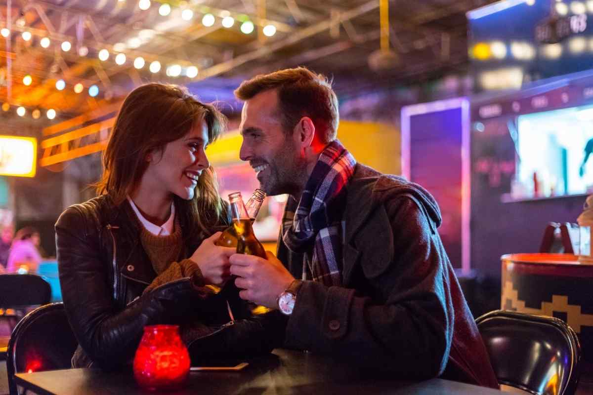 A confident, well-dressed man engaged in easy conversation, embodying the Libra man's natural social charm